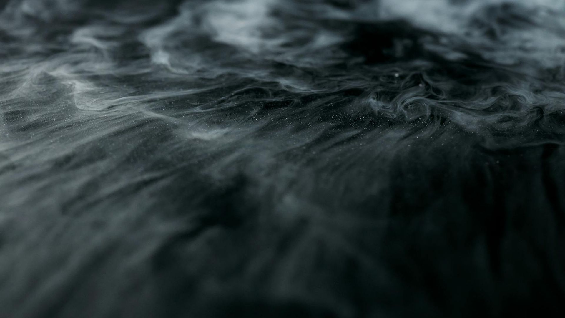 Abstract dark background representing a space for movement and practice.